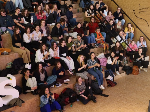 The audience watching the Open Mic Night