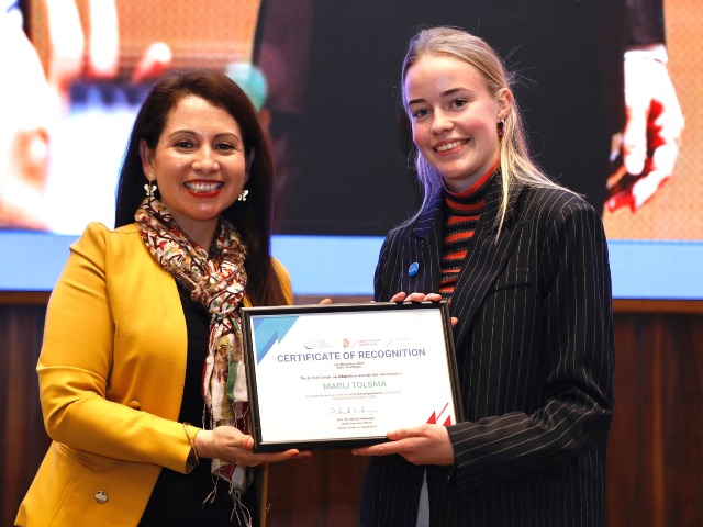 Marij Tolsma being awarded the certificate of reocgnition for winning the annual op-ed competition organized by the Global Center on Adaptation