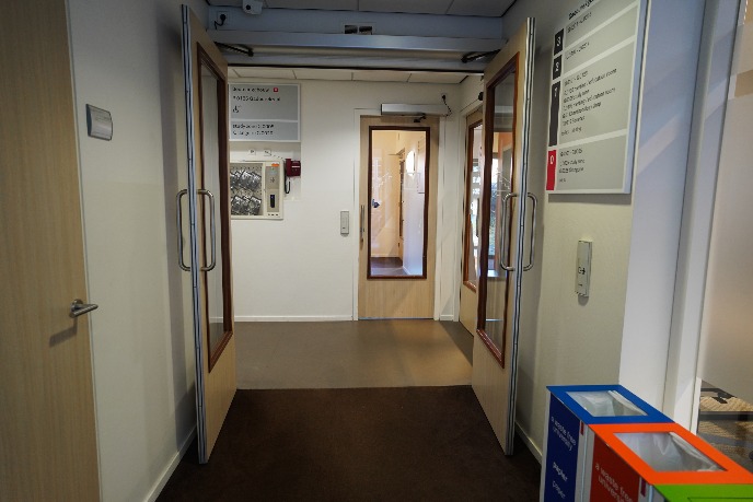 Doors right after main entrance, to be openen by push button on right wall