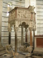 Nicola Pisano's pulpit, located inside the Baptistery of Pisa